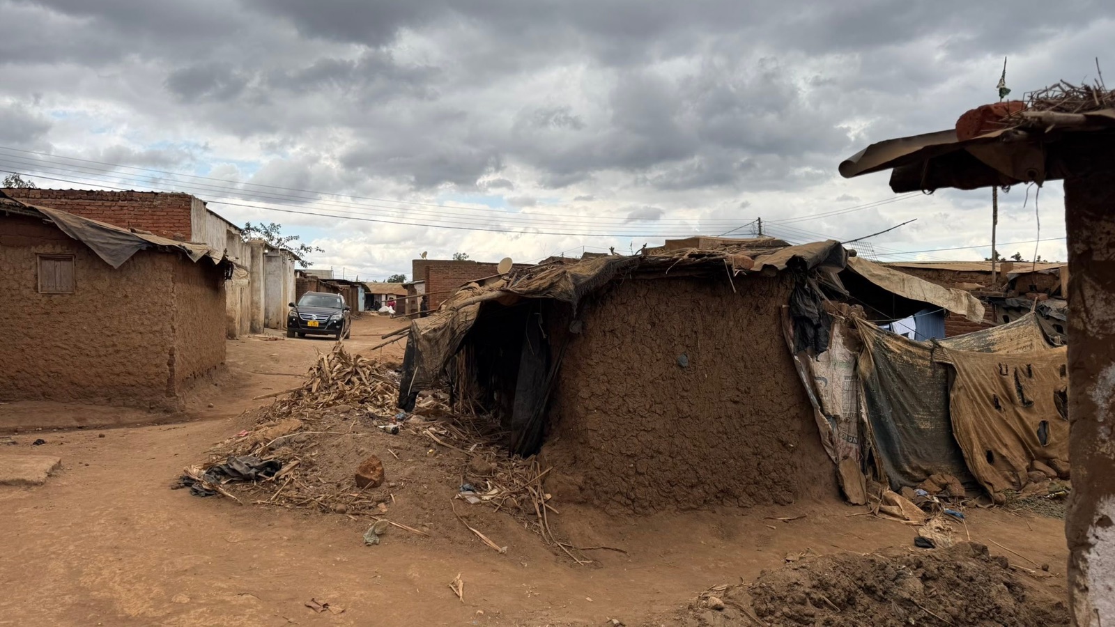 Closely spaced homes along a lane in Dzaleka